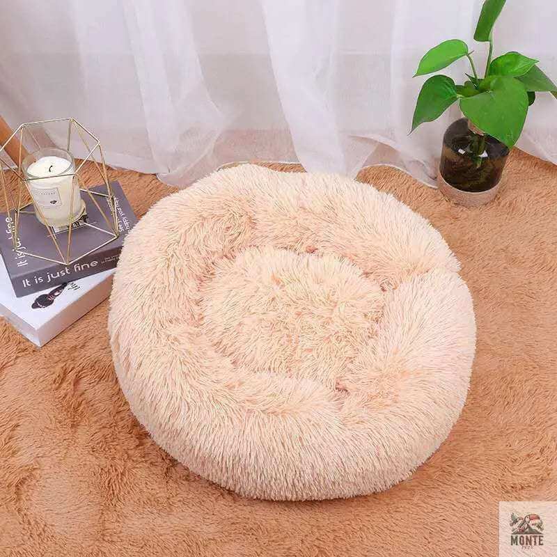 Rundes Kuschelbett für Hunde und Katzen - Fluffy Comfort in zartem Rosa, ideal für Geborgenheit und Entspannung.