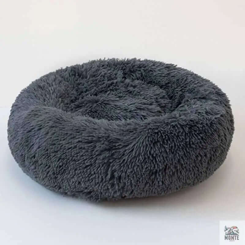 Rundes Kuschelbett für Hunde und Katzen - Fluffy Comfort in grau, idealer Rückzugsort für Haustiere.