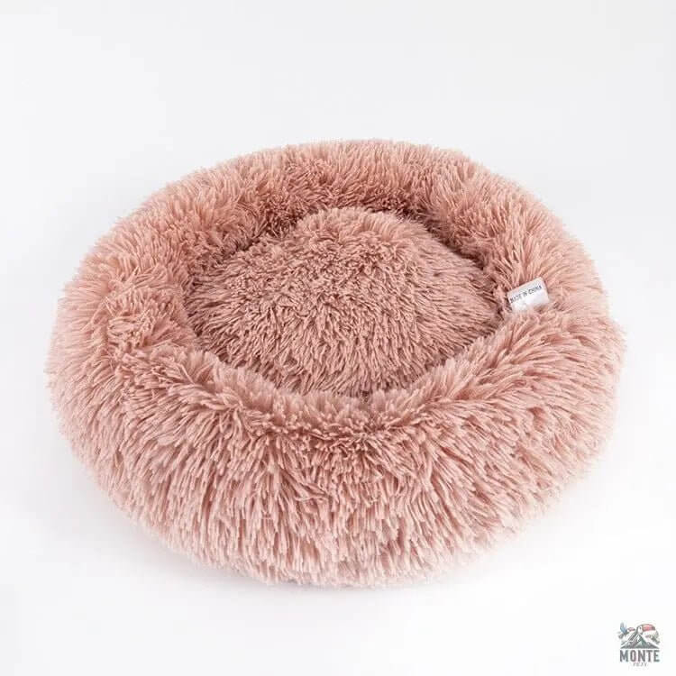 Rundes Kuschelbett für Hunde und Katzen - Fluffy Comfort in zartem Rosé für gemütliche Rückzugsorte.